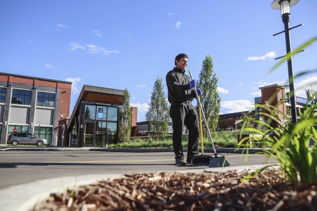 RPM Facility Services crew performing exterior commercial property maintenance